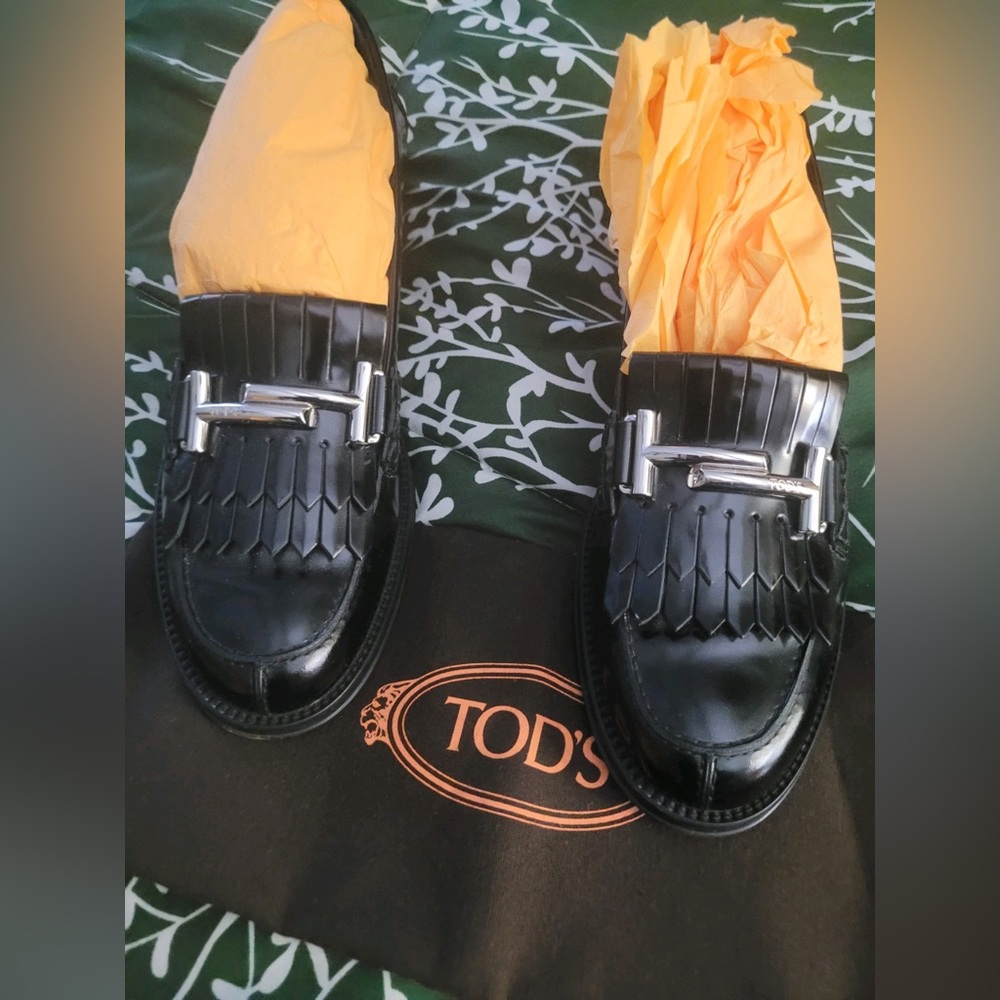 Black loafers with silver bracket